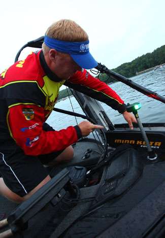 Greg Vinson makes a few last-minute boat preparations to compensate for the big waves Kentucky Lake is known for.