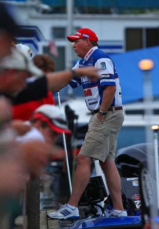 Alton Jones stands on the deck of his boat while talking with fans gathered to see the anglers blast off Thursday.