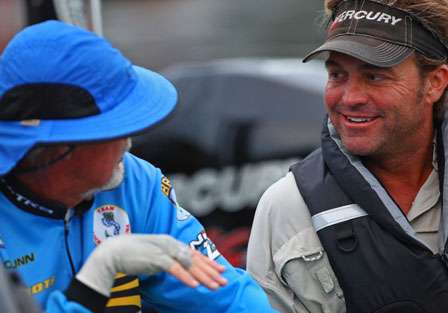 Rick Clunn and Byron Velvick talk while waiting in their boats for the launch to begin on the second day of Tennessee Triumph competition.