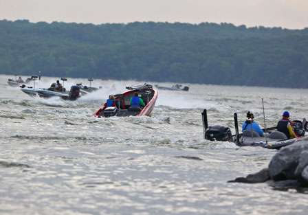 Shortly after VanDam takes off, the lake is abuzz with spectators trying to follow him to his first fishing hole.