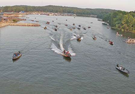After winding through an armada of spectators, Kevin VanDam takes off for the final day of the Tennessee Triumph.