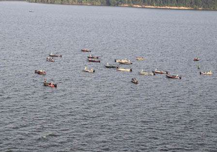 A flotilla of spectator boats surrounded Kevin VanDam on his first stop Saturday morning.