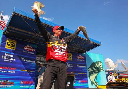 VanDam thrusts two of his winning fish into the air as Edwin Evers looks on from the Toyota Hot Seat.