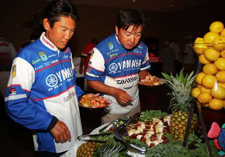 Takahiro Omori and Yusuke Miyazaki check out the lavish spread of food provided by the host city of Muskogee, Okla. 