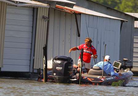 Keith Poche moves to the back of the boat in an attempt to land a large Fort Gibson bass.  
