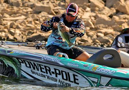 Lane finally secures the fish that was barely hooked on the back hook of his crankbait.