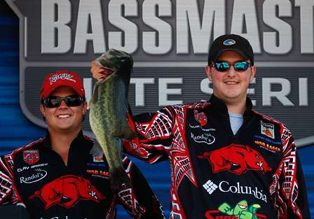 Taylor Denniston holds up the biggest bass caught in the Bassmaster College Classic, a largemouth close to 7 pounds.