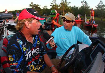 Keith Alan talks to Rick Morris while waiting at the dock for the 7:30 a.m. ET launch.