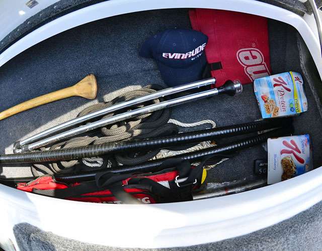 In the starboard side locker are various accoutrements, including the lights, a push pole, some snacks, an extra weigh-in bag, a spare PFD and the thing he hopes he never has to use â a paddle.