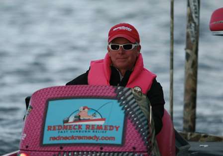 The man in pink, Elite Series pro Kevin Short makes his way through the inspection line before taking to Lake Champlain for the first day of competition.
