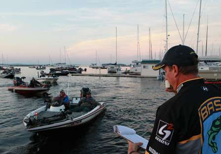 BASS Tournament Director Chris Bowes sorts through the boats, getting them in line, in order before they are inspected for the Day Two launch.