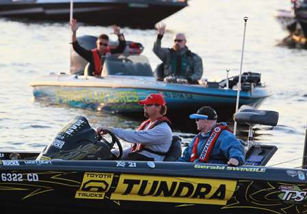 Elite pro Gerald Swindle makes his way into the line up as the anglers behind him acknowledge Tournament Director Chris Bowes after he calls out their boat number.
