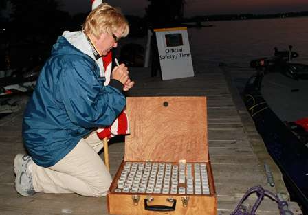 BASS Official Deborah Wilkinson works on re-writing the numbers on the time-in key fobs which are handed out to the corresponding boats each morning and collected from them along with the recorded time in the evening.
