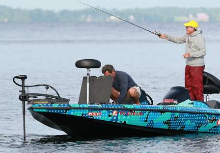 Pro Jimmy Kennedy goes into the box for a lure change as his co-angler Bill Tyger makes a cast.