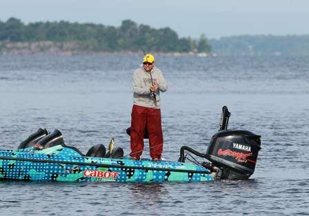 While his pro, Jimmy Kennedy is changing lures, Bill Tyger boats a short fish. The number of fish have not been an issue the first two days on Champlain, the size, however, has been an issue.
