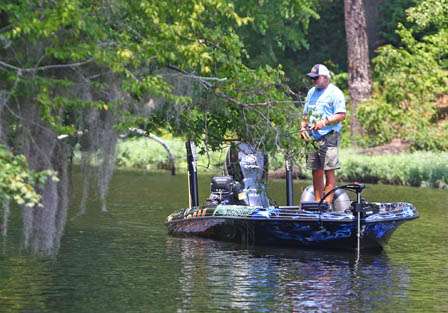 Tommy Biffle fishes through a cut up the Coosa River Friday.