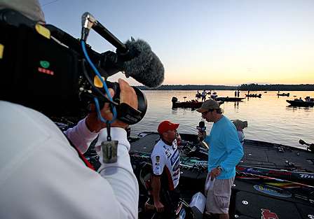 An ESPN cameraman rolls tape as Keith Alan interviews Lane before takeoff.
