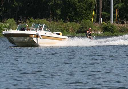 A young water skier is pulled through the canal to New Lake.