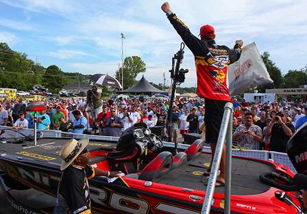 Kevin VanDam pumps his fist to amp up the crowd as he gets set to take the stage.