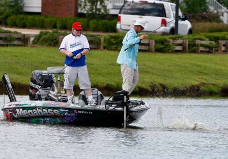 Aaron Martens plays a fish alongside the boat as it makes another futile effort to shake free.