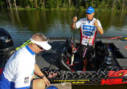 Russ Lane gets rods ready for his partner John Lightsey before their day of fishing at The Waters begins.
