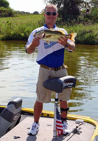 Sean DeBevoise proudly holds up the biggest bass of his life, which he caught while fishing with Gary Klein Tuesday.
