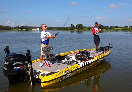 DeBevoise makes a long cast with a crankbait, as he and Klein fish underwater log jams at The Waters' trophy bass lake.
