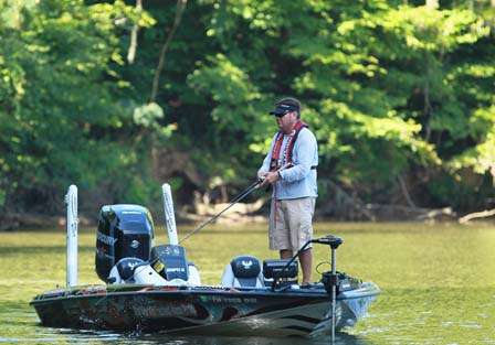 Greg Hackney, a shallow water expert, was further down the river in the mouth of a creek, also flipping shallow cover