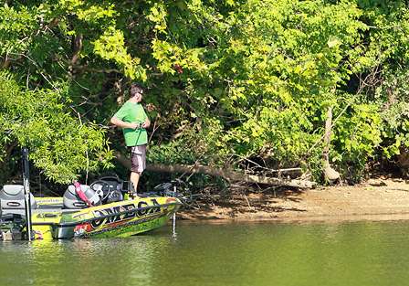 Derek Remitz fishes cover along the bank on day two of practice.