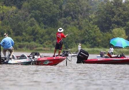 John Crews cast in the middle of a spectator boats trying to catch a limit on Day One.