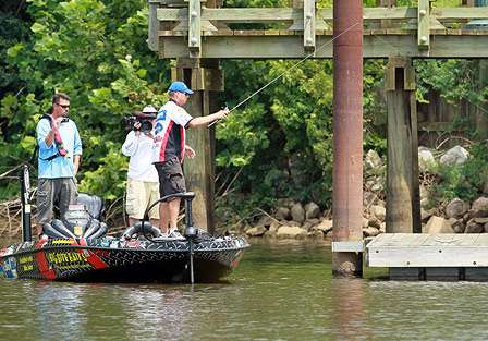 Russ Lane pitches to a dock on Day One, while Mark Zona interviews him.