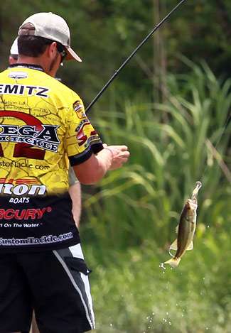 Remitz swings a small bass into the boat Friday.