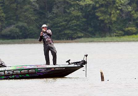 Martens sets the hook on a big bass Friday while fishing shallow cover.