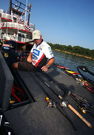 Lane checks over his rod and reels while organizing his rod locker.