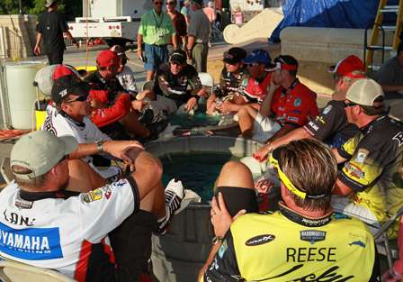 All of the anglers sit back stage at the soak tanks and wait for the official weigh in to get underway.