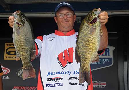 Jimmy Johnson hoists a couple of smallmouth from his 20-pound bag that gave him the lead at the Northern Divisional. 
