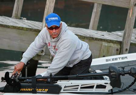 Dave Mansue straps down his trolling motor as he gets ready for the Day Two launch.