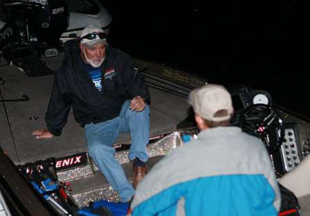 Ray Brazier talks fishing with his co-angler for Day One as they wait for the official launch time.