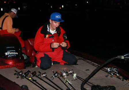 Adrian Avena scrambles around on his deck making fast changes in lures in preparation for Day Two.