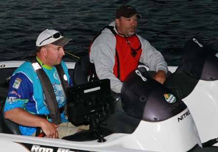 Ron Plocek and his co-angler ease through the inspection line before taking to the bay.