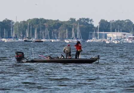 Just up the bay from the other anglers, David Dudley pulls a good sized keeper from the waters of the Upper Chesapeake.