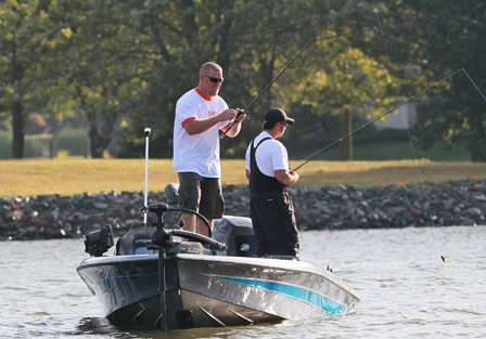 Joe Thompson adjusts his lure after missing a fish. 