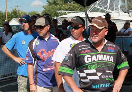 Joe Thompson leads a group of anglers who all wait at the final tanks at the side of the Bassmaster stage.