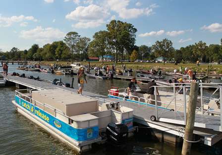 Bass boats line the dock as the final anglers make their way to the stage.