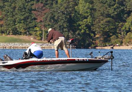 Another Upper Chesapeake bass goes on a tear at the side of the boat, stripping light line from the spool.