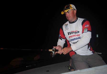 Chris Flint of New York gets out his rods while waiting for his partner before the Day One takeoff.
