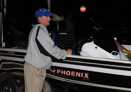 Pro Greg Pugh preps his Phoenix boat as he waits in line to be launched.