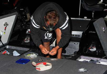 Stephen Johnston uses a headlamp to prepare his gear for Day Two of the Bass Pro Shops Bassmaster Central Open.