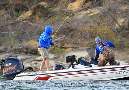 After making a move up the lake, Rob Medders helps net a bass for his co-angler, John Moon.