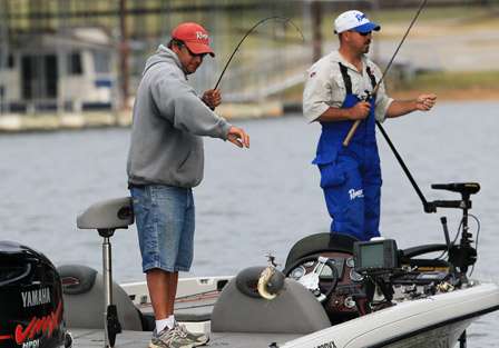 Co-angler Larry Rea needs no help from his pro, Spencer McAlester with boating this bass.